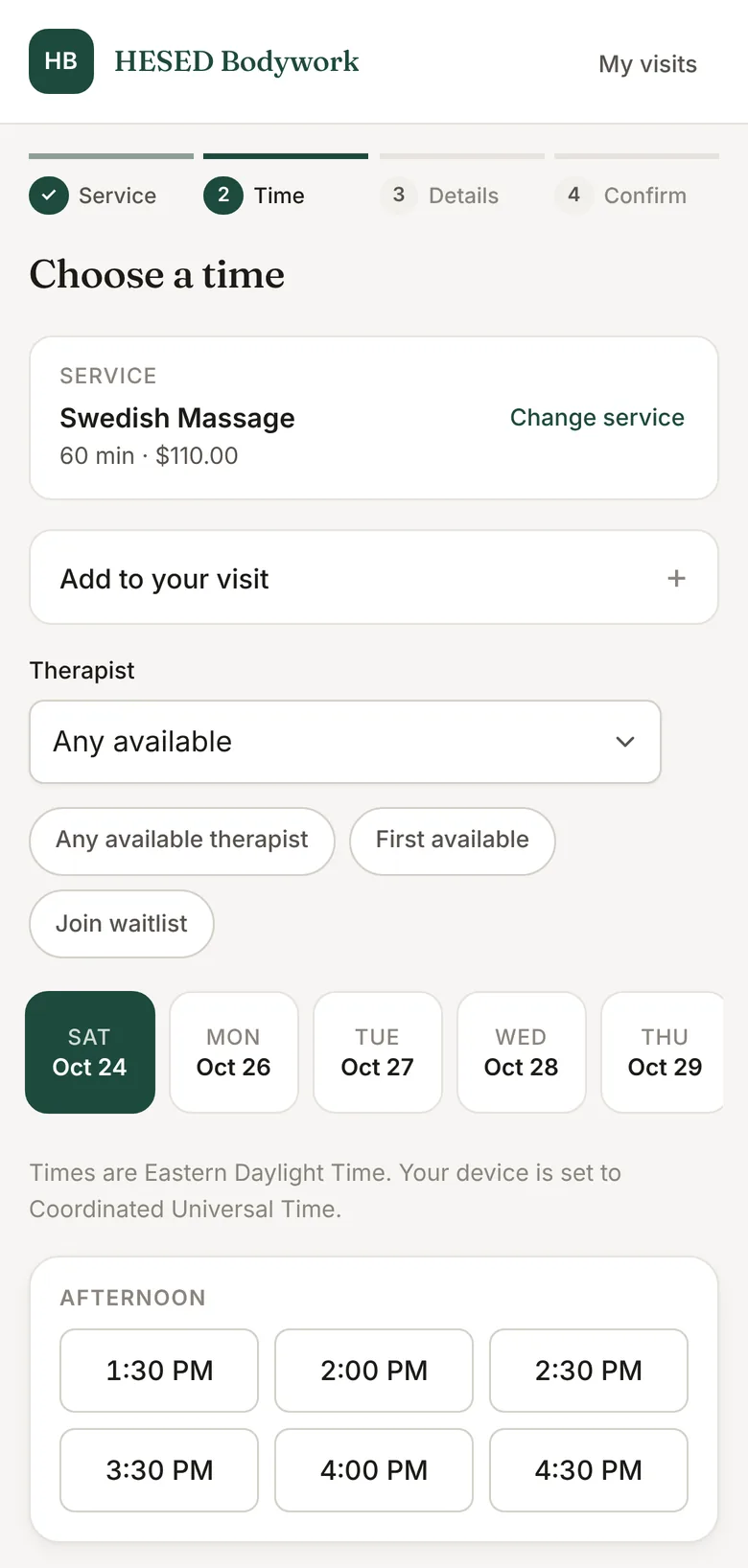 The booking page on a phone, showing open times to pick.